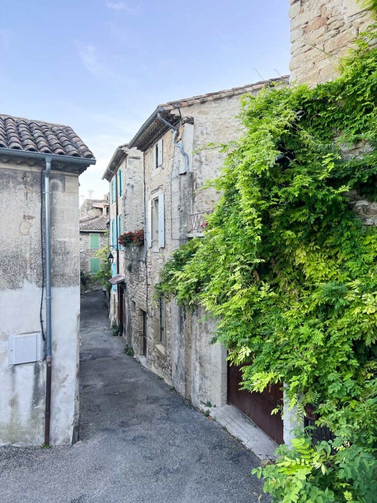 A small path winds its way through the houses in the village of Grignan, France.