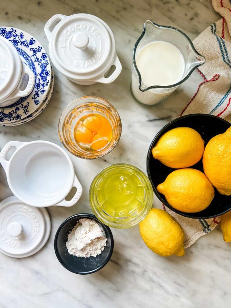 All the ingredients for baked lemon pudding are on the kitchen counter and ready for mixing.