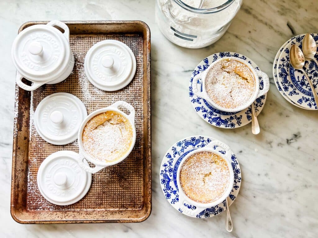 Balke Lemon pudding in mini Staub cocottes and dusted with confectioners' sugar is a fun summery dessert for any occasion.