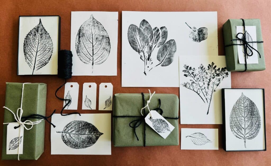 Monoprinting with nature examples spread out on brown kraft paper. 