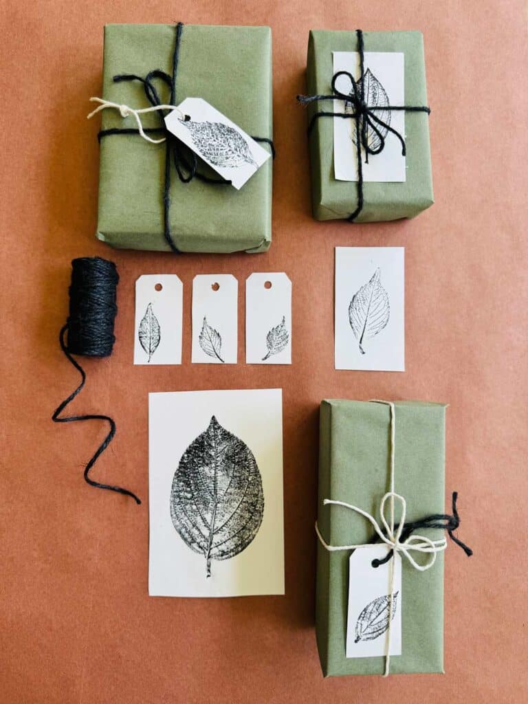 Examples of gift tags and cards have mono printing. The gift tags are attached with black and white twine.