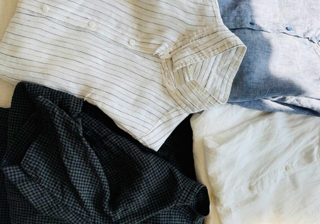 linen shirts buttoned up, folded. 