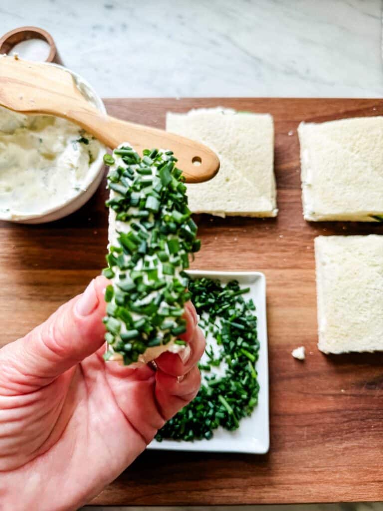 Cucumber sandwiches with Chive Sprinkles. White plates, glasses, Chips.