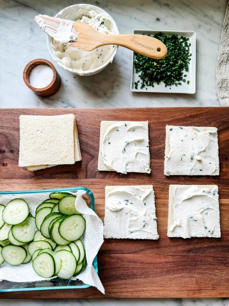 Cucumber Tea Sandwiches with Cream Cheese & Chives using thin sliced Pepperidge Farm white sandwoich bread, a smear of chive cream cheese...