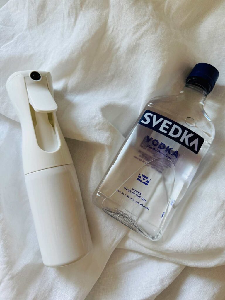 vodka, mist spray bottle, linen clothes