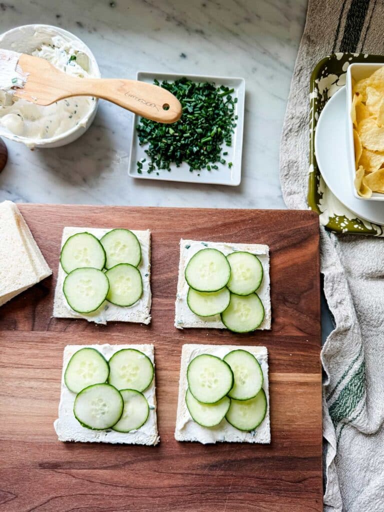 Cream Cheese & Chives using thin sliced Pepperidge Farm white sandwoich bread, a smear of chive cream cheese, and a layer of cucumbers.