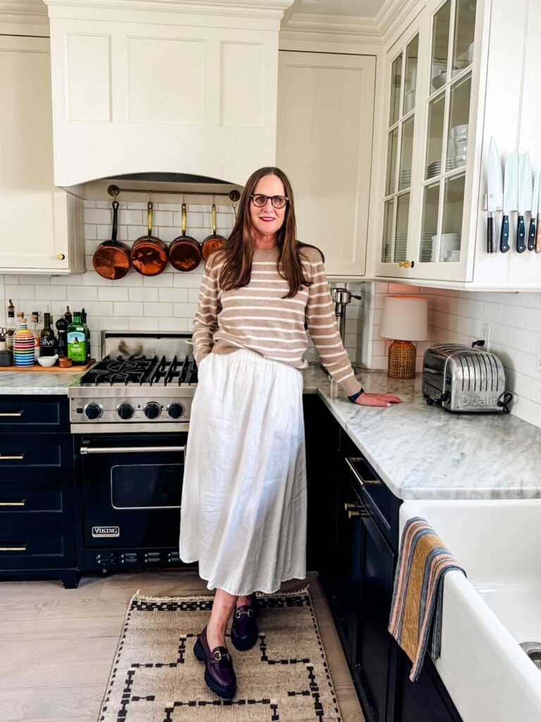 woman wearing cashmere sweater with an Eileen Fisher linen skirt and Bass loafers.