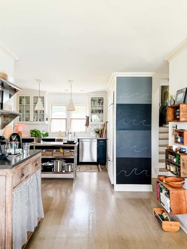 Hardware, pretty Libeco linen dish towels, a cozy kitchen lamp, baskets, and cafe curtains, chalkboard wall.