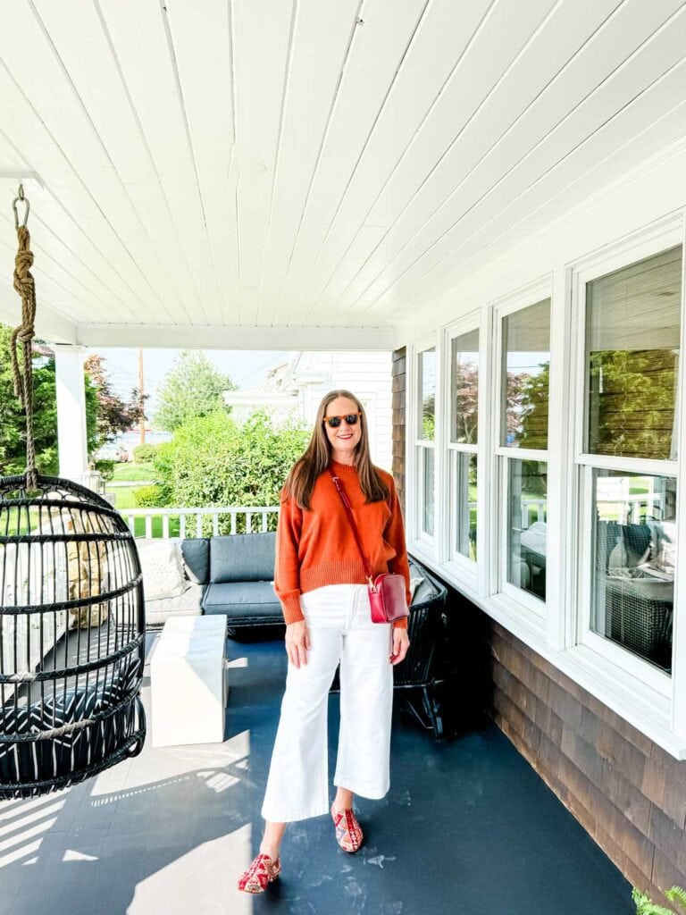 cotton boyfriend sweater from Quince with the burgundy crossbody bag.