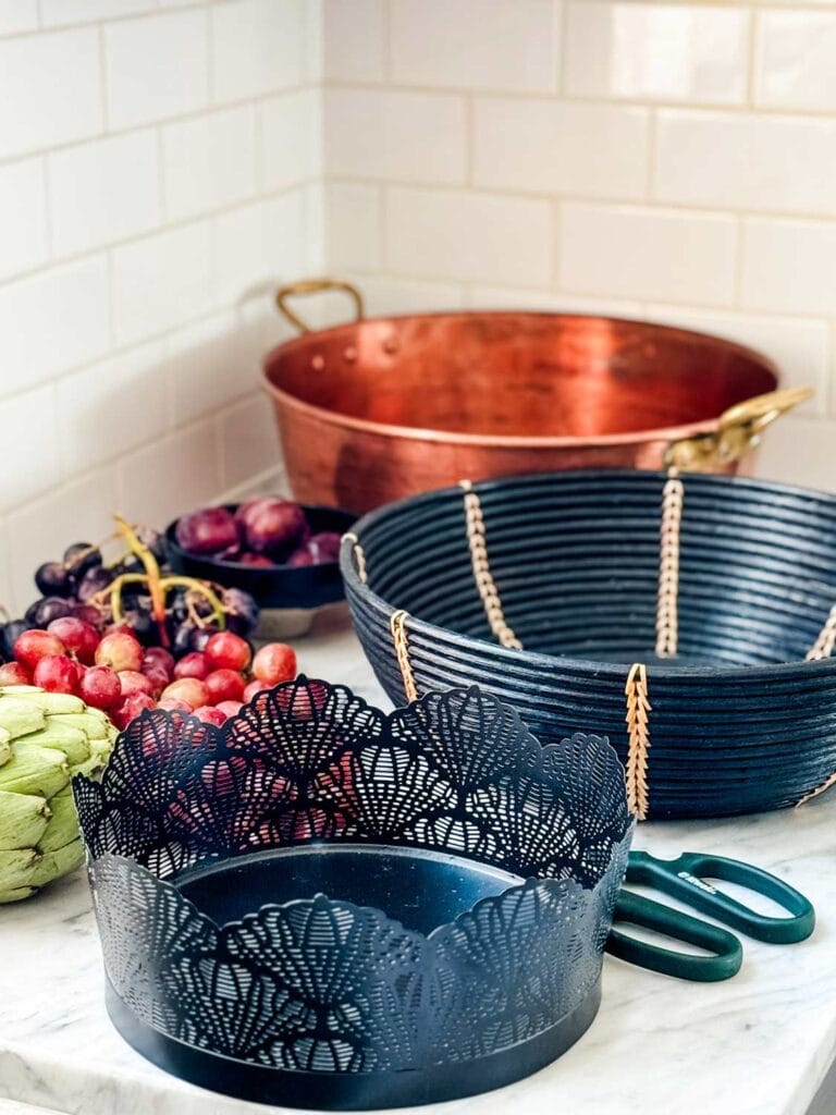 How to Make a Simple Autumn Centerpiece for Your Table - Black baskets, copper pan, grapes, scissors.