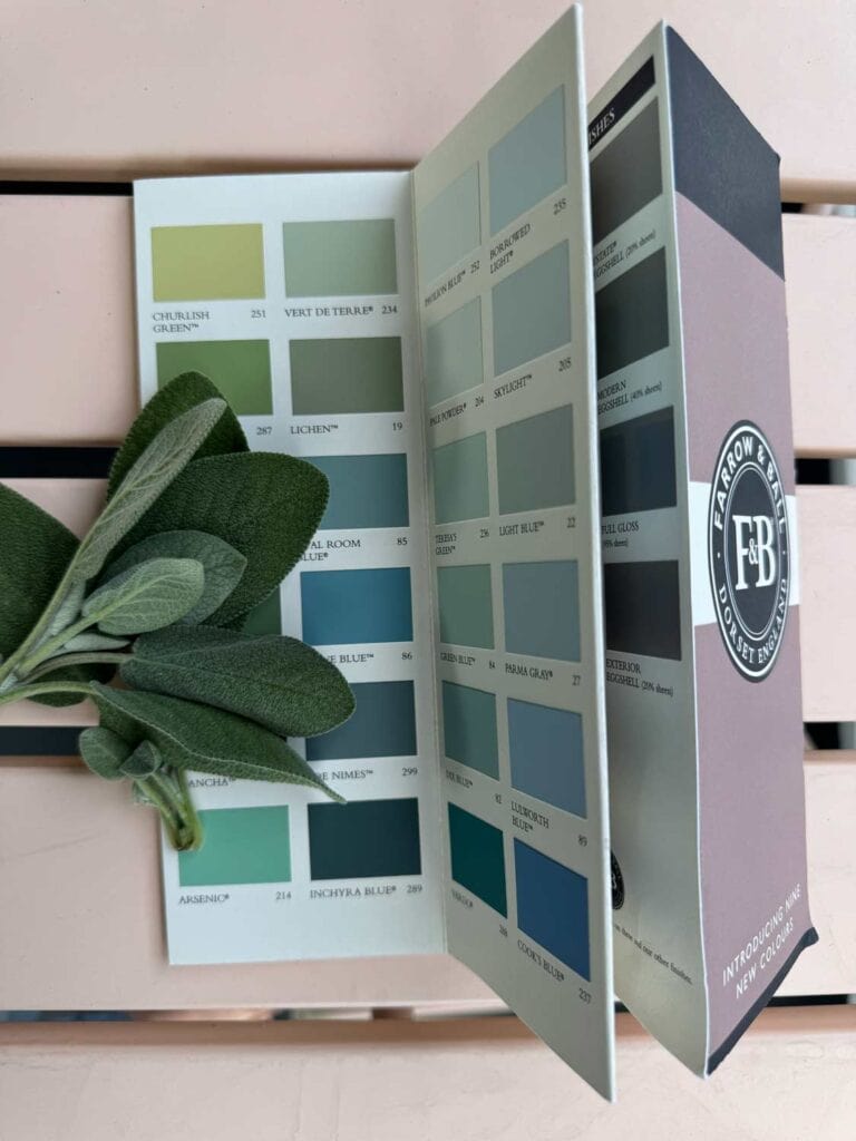 Fresh sage from the garden is on top of color samples from Farrow & Ball.