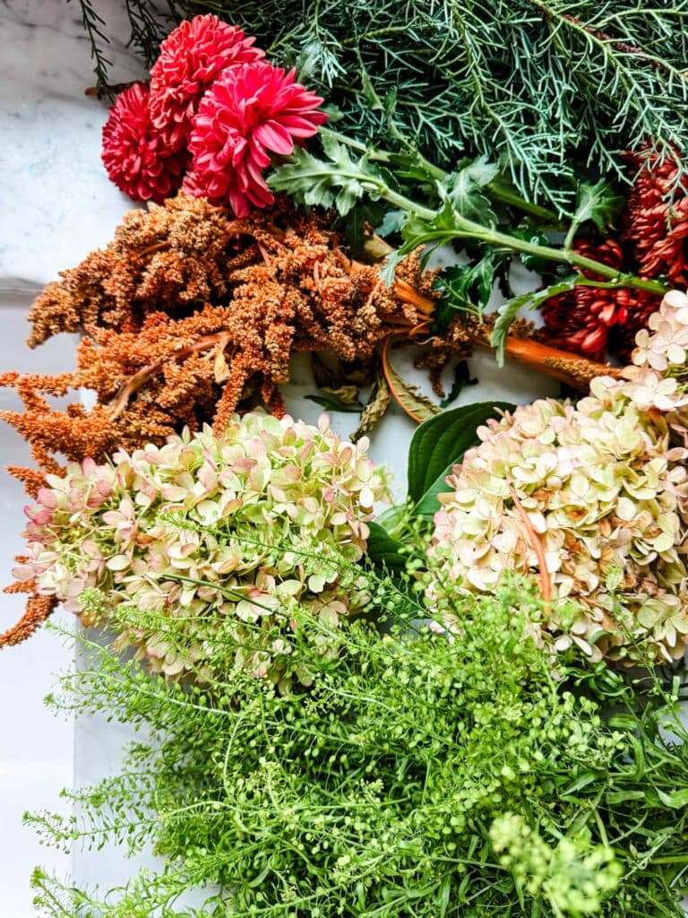 Fall flowers on counter next to sink 