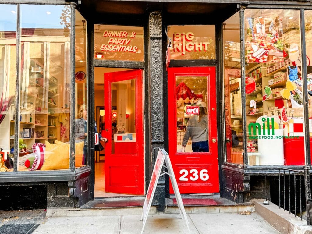 Big Night retail store in the West Village of New York City. It has bright red doors and colors everywhere. Each section has a main color while still having multiple colors present.