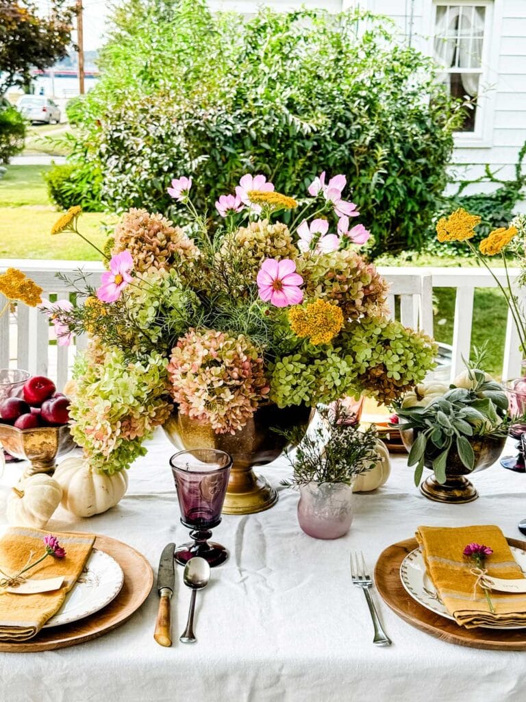 A beautiful tablescape on an outdoor table makes this a special table for guests.