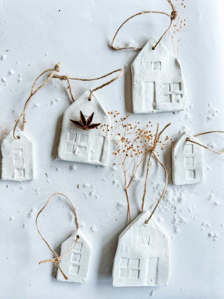 Clay house Christmas ornaments with some foraged sticks.