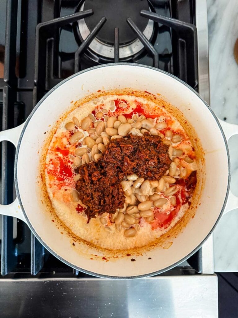 Chopped sun-dried tomatoes in olive oil have been added to the bean mixture.