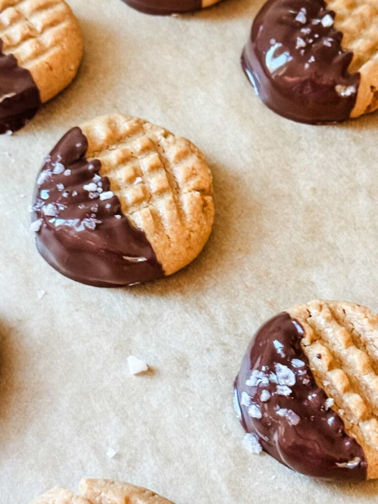 Peanut butter cookies half dipped in chocolate. 