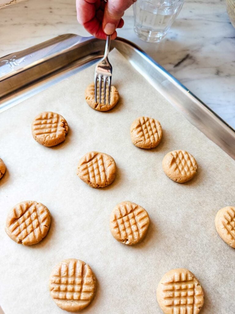 Peanut butter cookies criss cross pattern with fork.