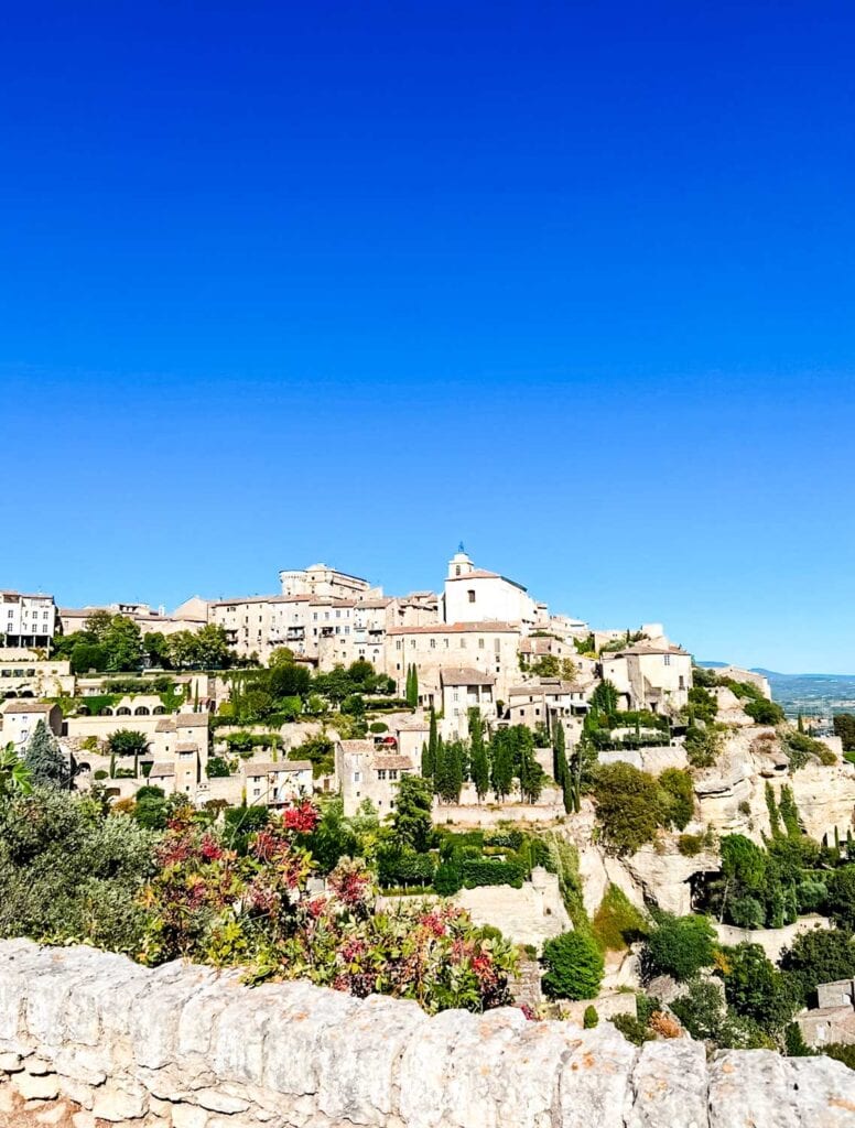 The old town of Gordes, France, sits high above on a hilltop.