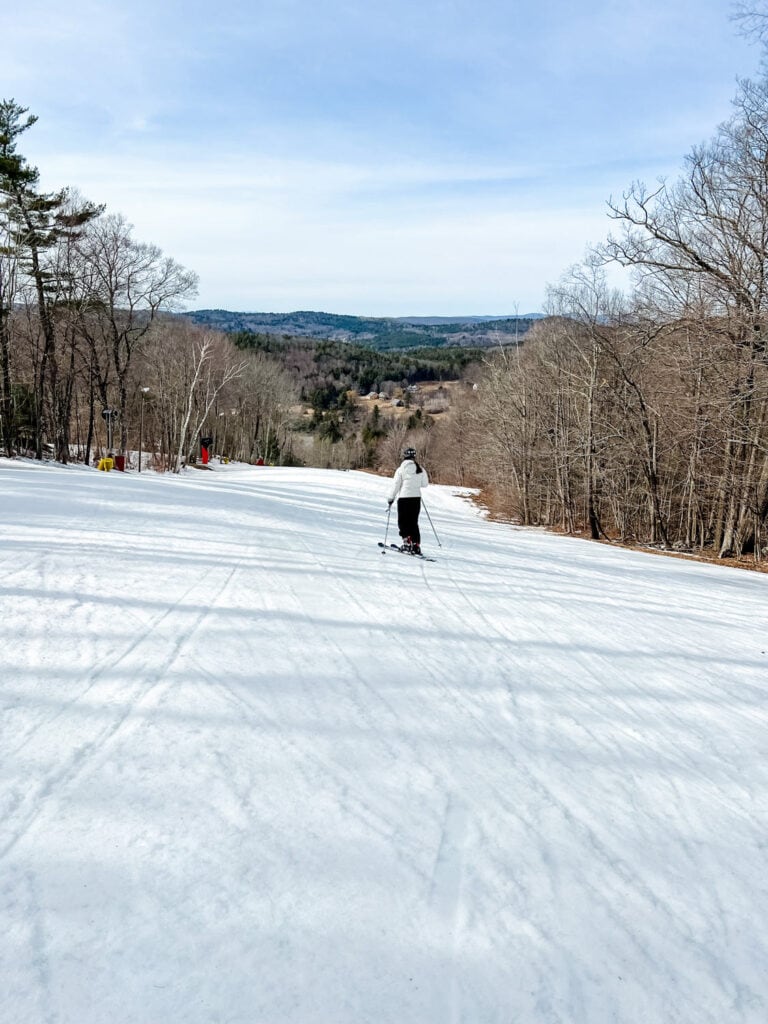 A woman is skiing on one of the trails at Mohawk Mountain.