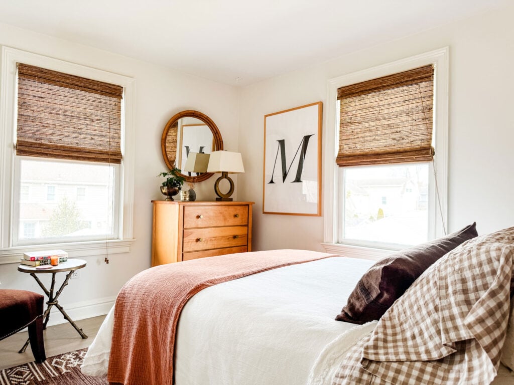 A small bedroom where the space has been maximized by adding just a few small things.