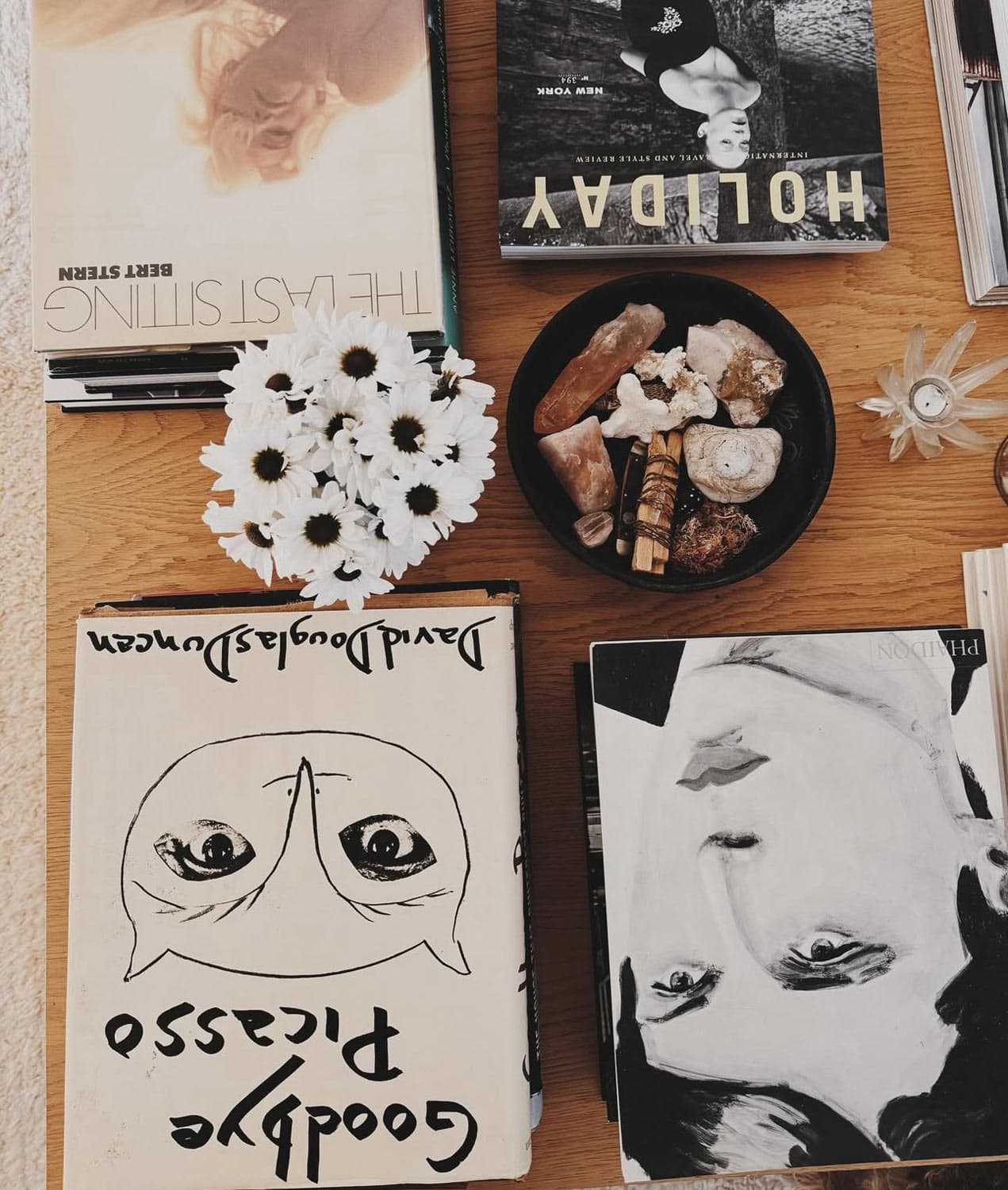 Books with faces, bowl of objects.