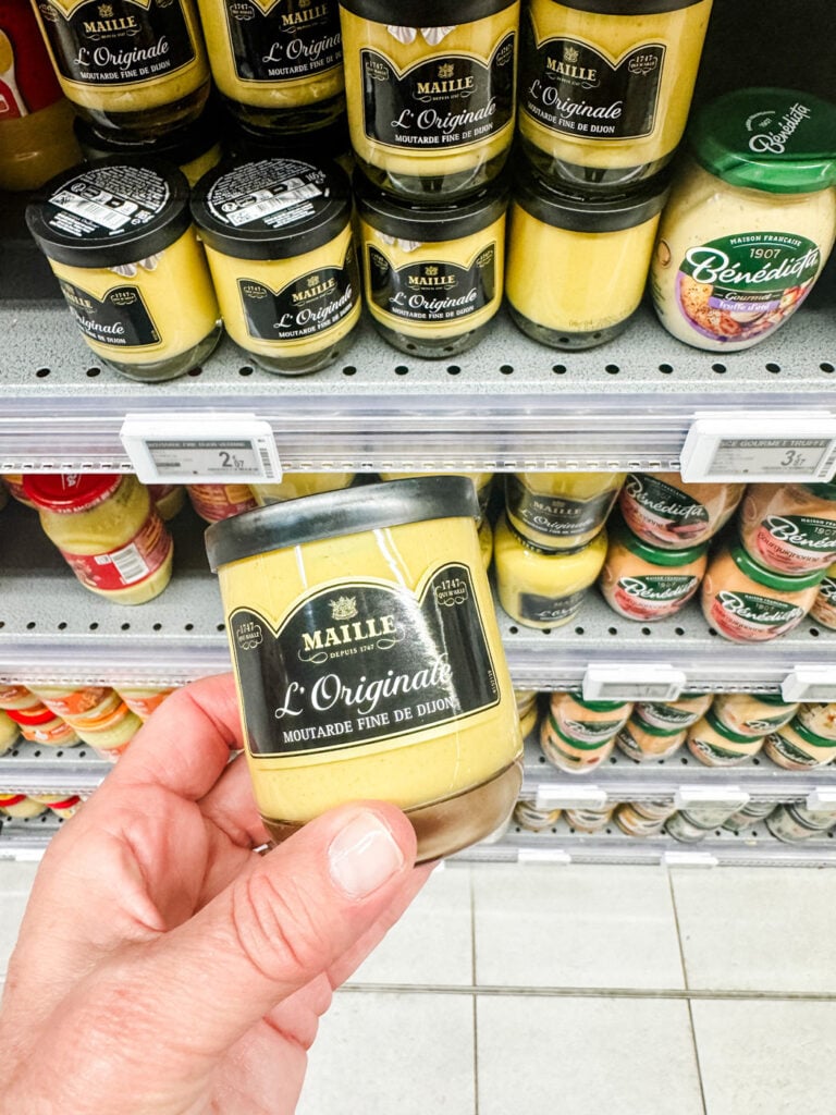 Small jars of Dijon mustard are a fun gift to bring home to friends and family.