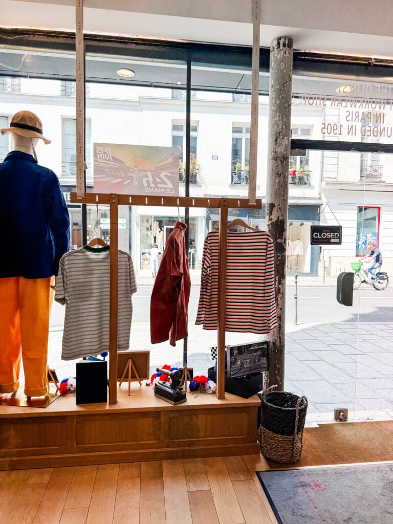 The window display, shot from inside the AL'O French workwear concept store in Paris.