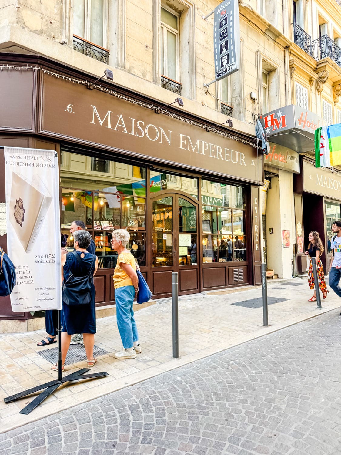 People outside the famous hardware store, Maison Empereur, in Marseille, France.