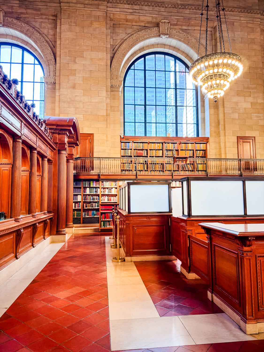 There is a check-out desk that divides the rose reading at the NYPL in half.