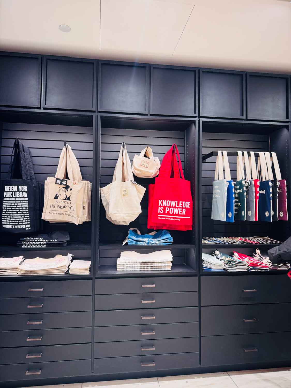 There is a wall of NYPL-branded tote bags in the gift shop. among many other classic New York City items.