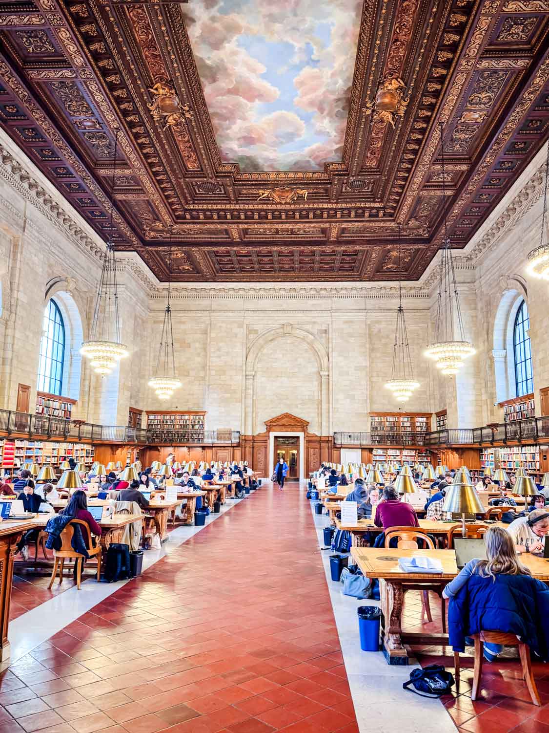 The rose reading room is massive in size with many tables with a lot of people working, studying or reading.