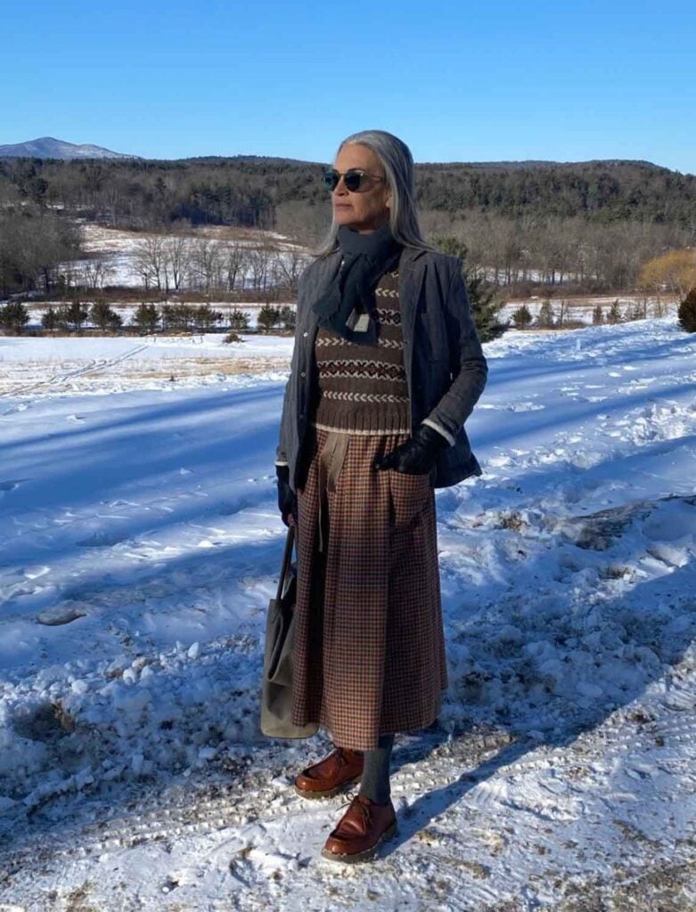 Actress-turned-designer Amanda Pays is standing in a field covered in snow in Hudson Valley.