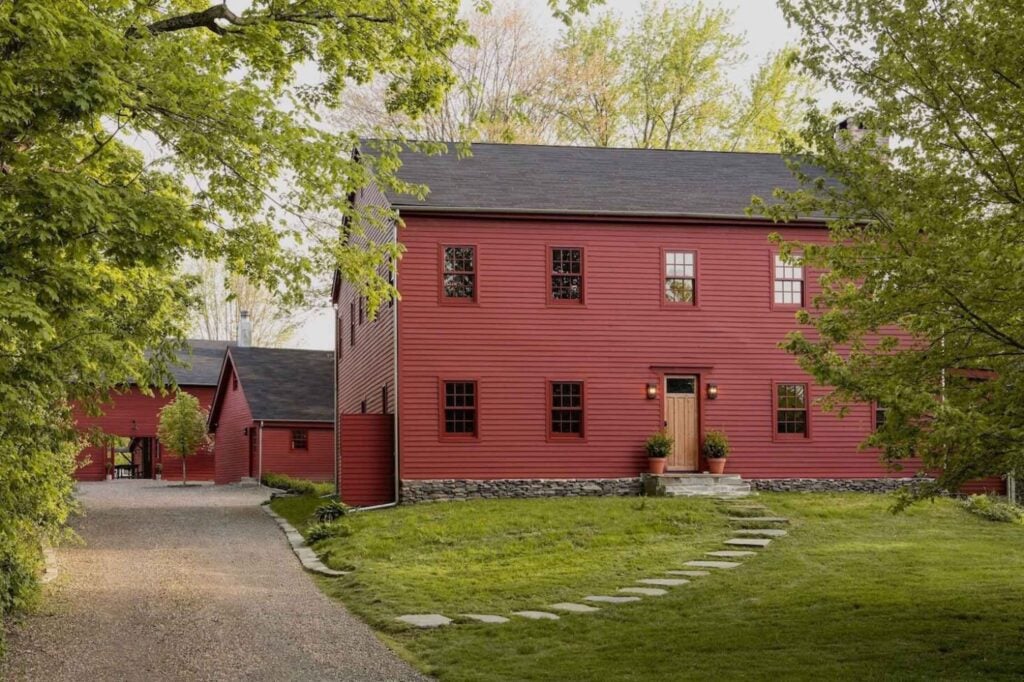 This dark red historic home was re-imagined by designer Amanda Pays.