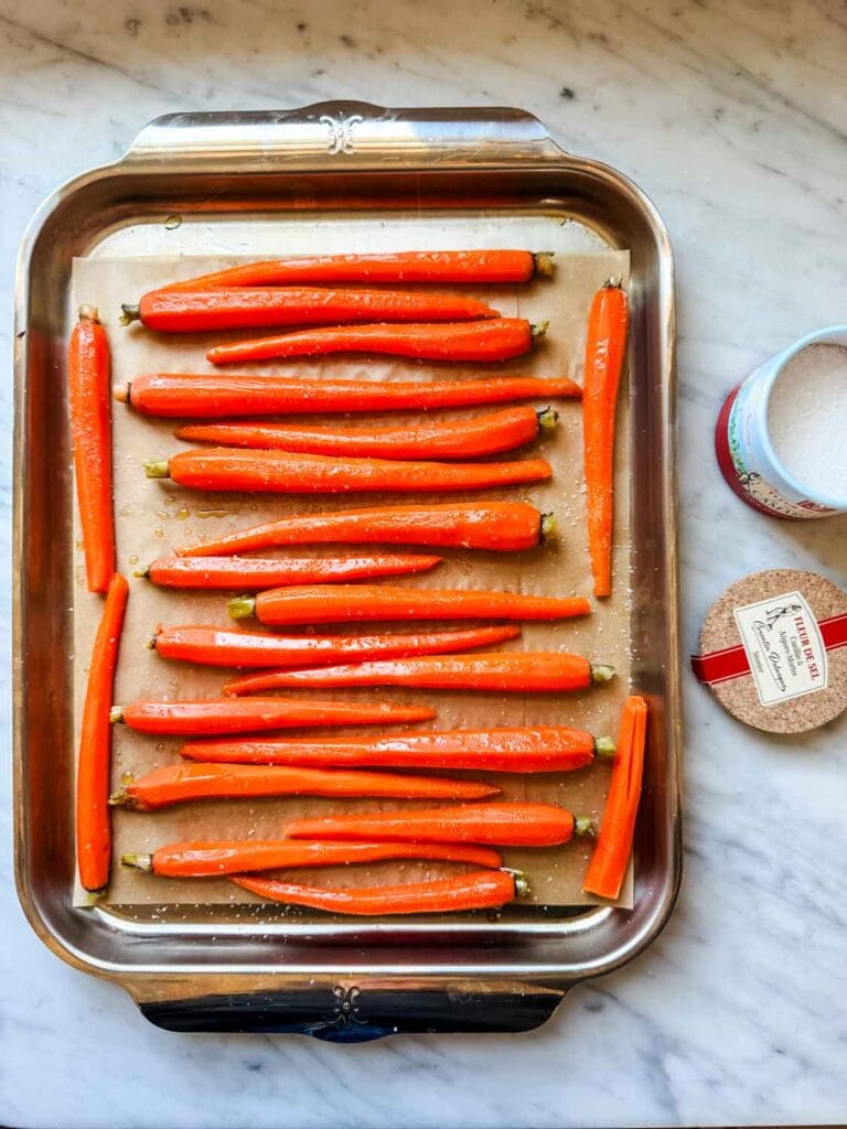 Roasted carrots on baking sheet.