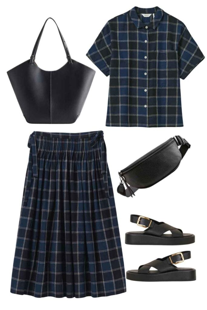 This is a graphic of a woman's plaid shirt and skirt, a black leather bag, and black sandals.