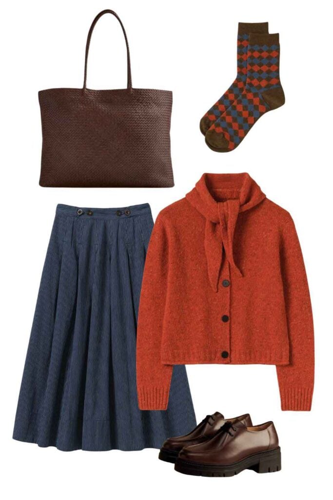 This is a graphic featuring a rust-colored sweater, a denim skirt, a brown leather bag, plaid socks, and brown Paraboot shoes.