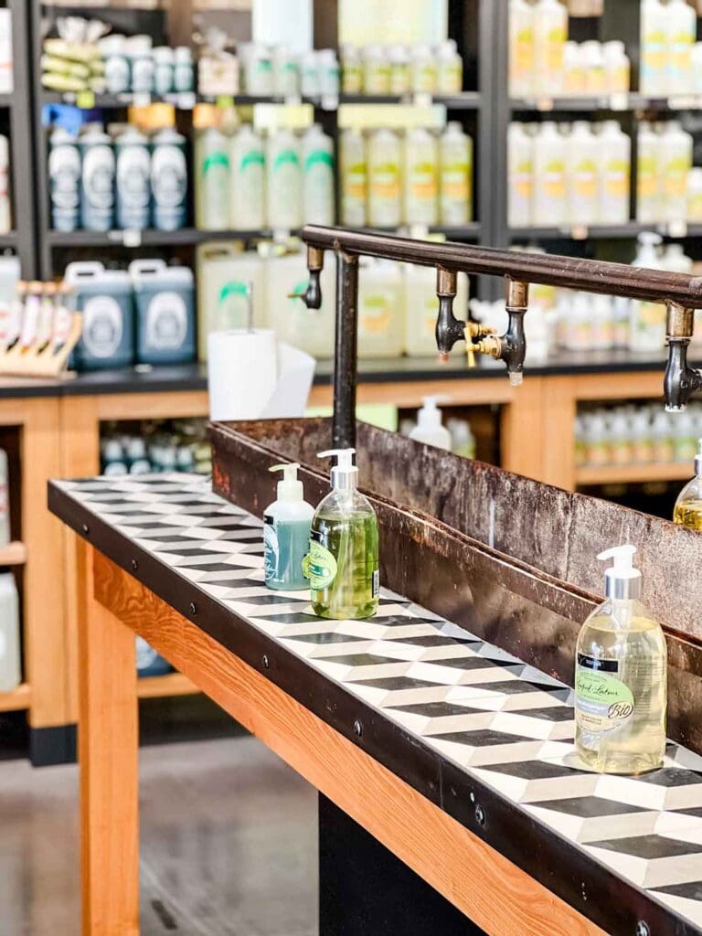 An old-fashioned sink with old faucets runs the length of this table, where you can sample the hand washes.