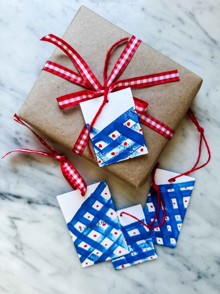 Kraft wrap, red and white gingham ribbon, painted tags.
