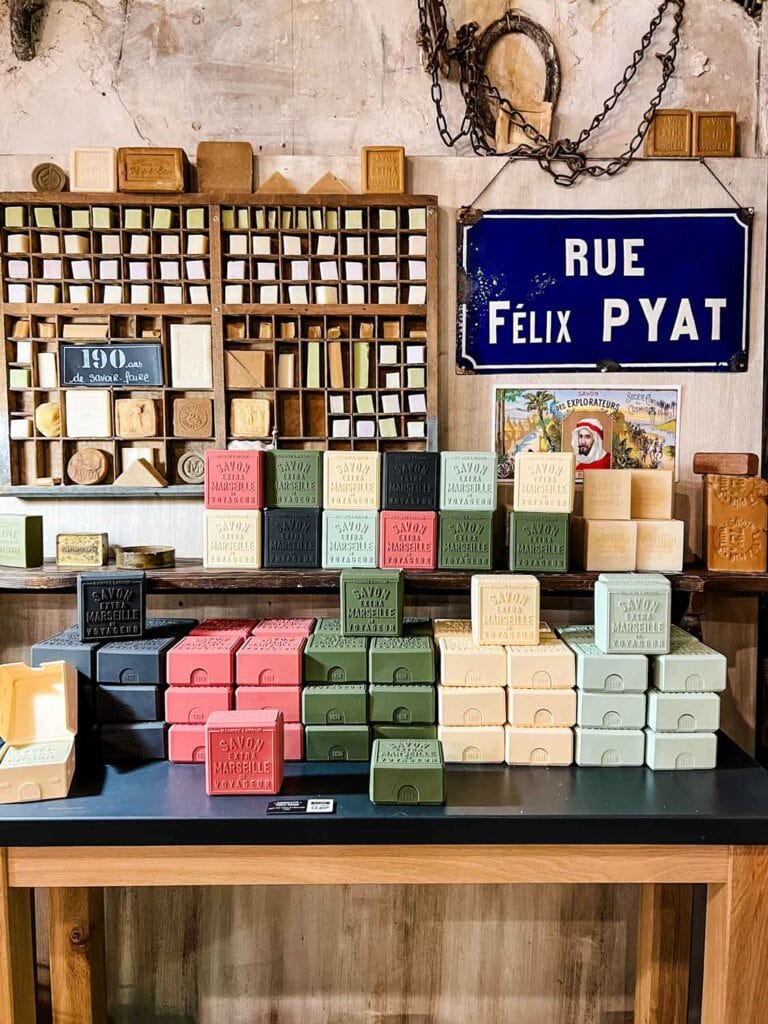 Cubes of soaps are next to boxes of soap in the display inside the Rampal Latour soap museum.