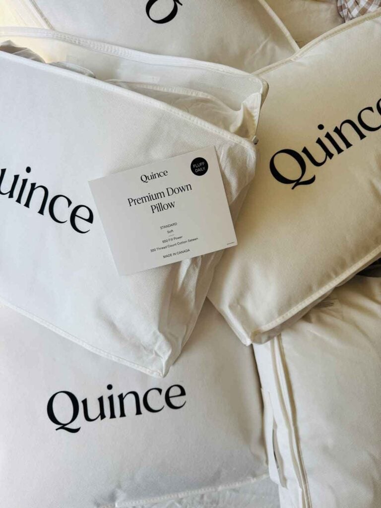 new bed pillows in bags from Quince.
