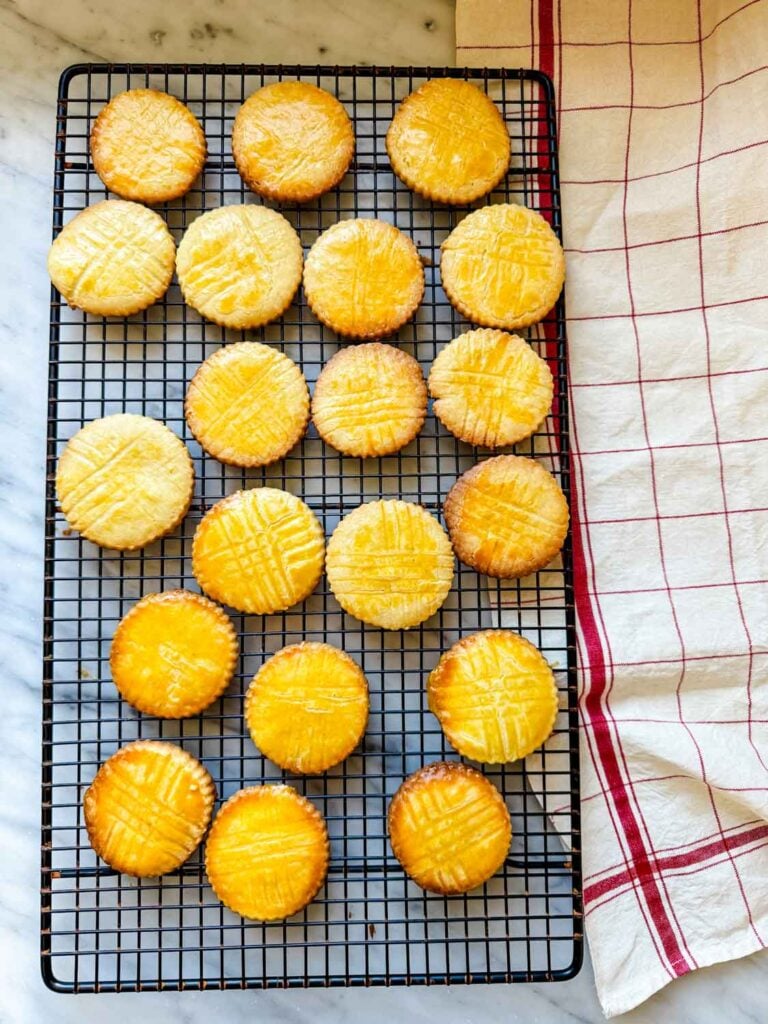 Sablés Breton cookies have been baked and are cooling on a wire rack.