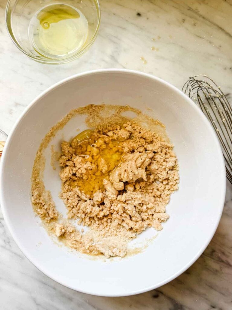 Egg whites are added to the browned butter and the flours and sugar.