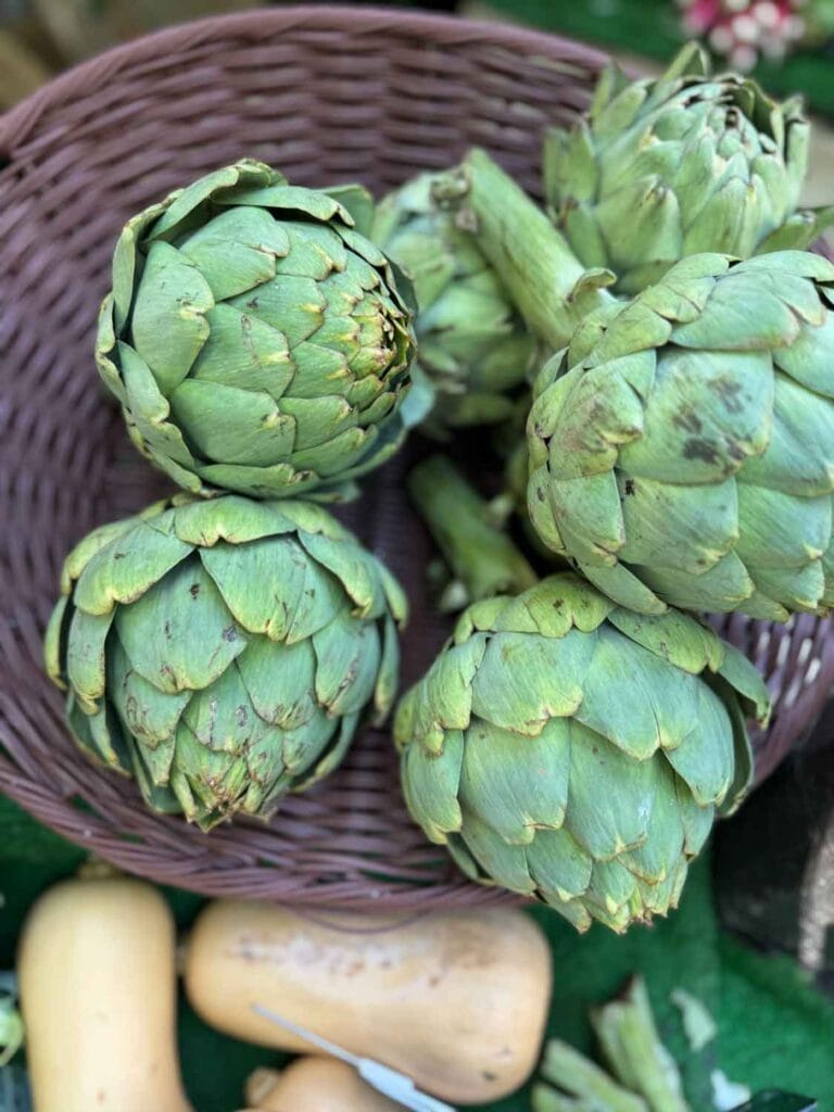 Artichokes and squash are available at Marché Raspail which is a large open-air market in the 6th arrondissement of Paris.