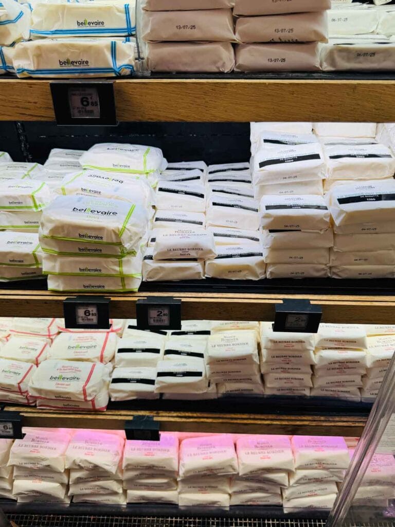 French butter with many different flavors are in the cooler at Le Grande Epicerie in Paris.