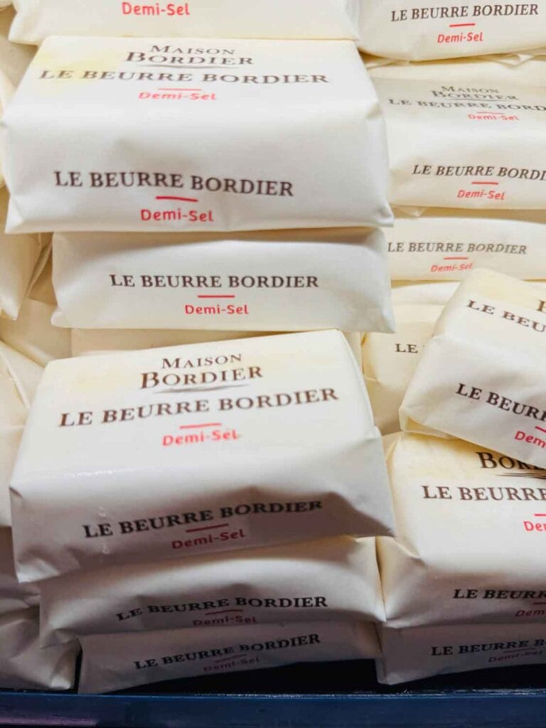Slightly salted French butter, wrapped in butcher paper, is the cooler at Le Grande Epicerie in Paris, France.