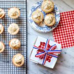Classic French financier tea cakes are packaged in a lovely white box with red, white, and blue ribbon.