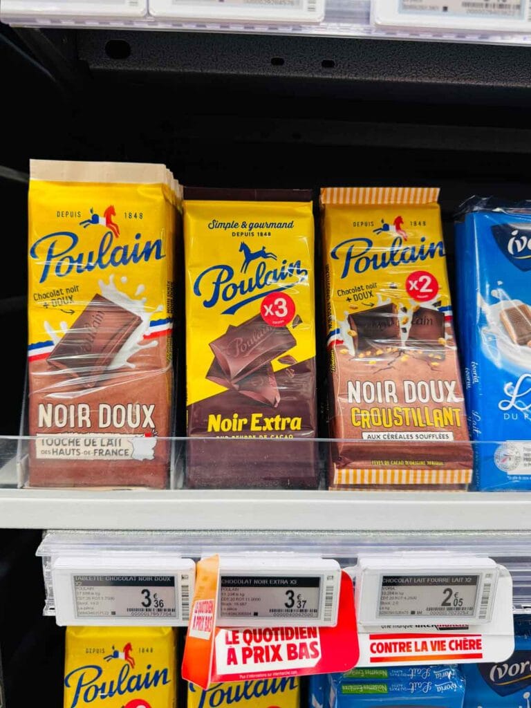 Poulain chocolate bars, made in France, are on the grocery store shelf in a small market in Grignan, France.