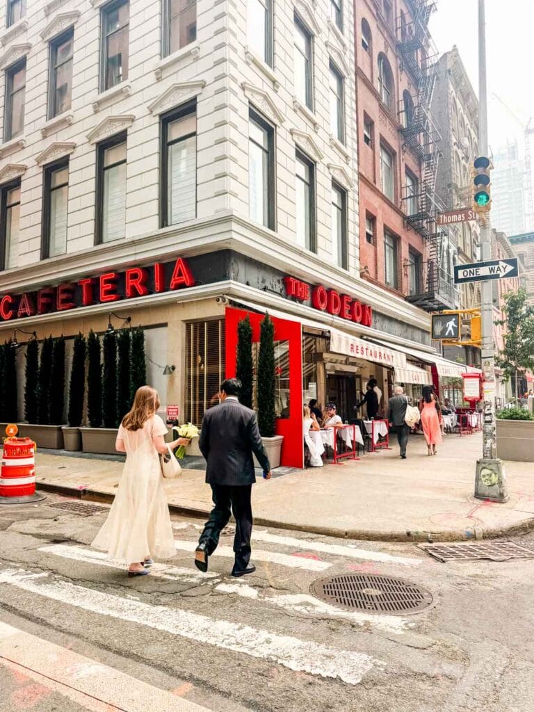 Bride and groom walking to The Odeon.