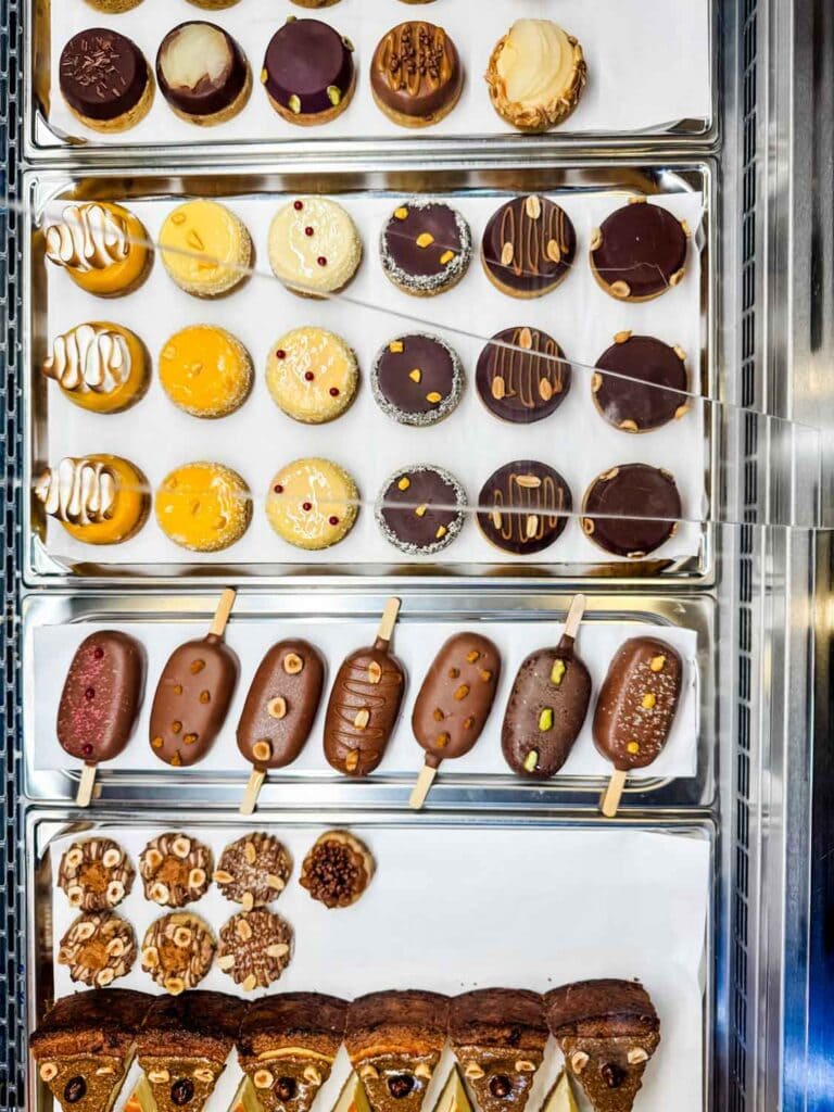 Artisan cookies of all different kinds line the counter inside Cookes by Moon's Paris store.